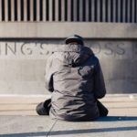 Man standing against a wall